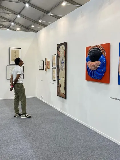Jitish Kallat observing the works on display.