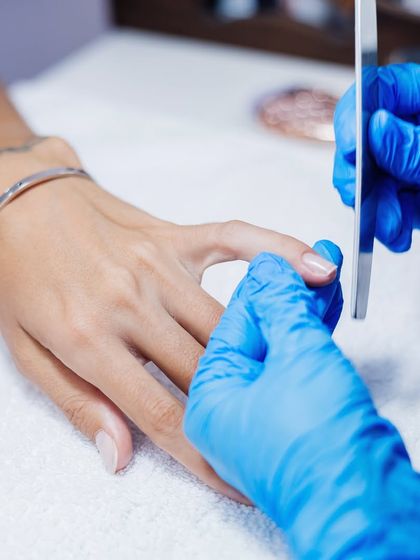 Precision in every movement. We expertly shape each nail with a file, creating the perfect canvas for your manicure.