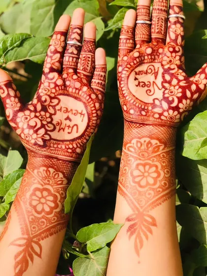 A fresh stain with the couple's names. The bright red color against the green leaves is just so beautiful.