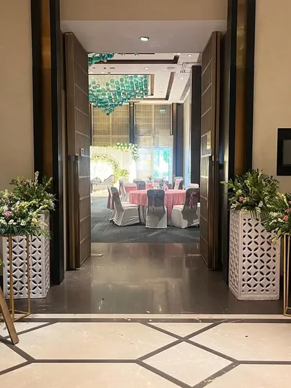Another example of a personalized welcome sign for Navdha and Sachin's Roka. The floral arrangements and elegant script set a sophisticated tone for the event.