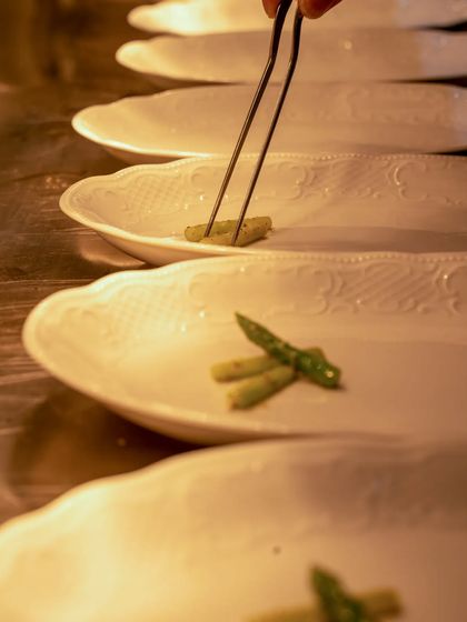 Another angle of the precise plating process, showing the care taken with each component.