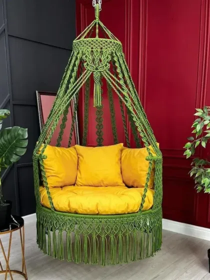 This olive green chair swing with a bright yellow cushion is a perfect example of custom color combinations. It's a single seater jhula, ideal for a reading corner or a small balcony.
