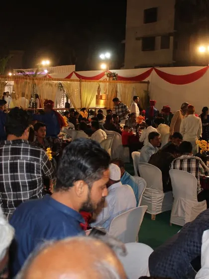A bustling reception scene at one of our catered events. We are equipped to handle large crowds, ensuring everyone is served efficiently and enjoys the celebration.