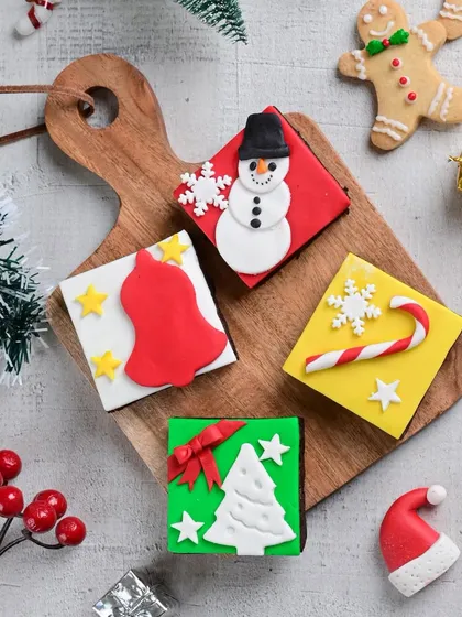 Our Christmas-themed brownies are always a hit. Each one is hand-decorated with designs like snowmen, bells, and Christmas trees.