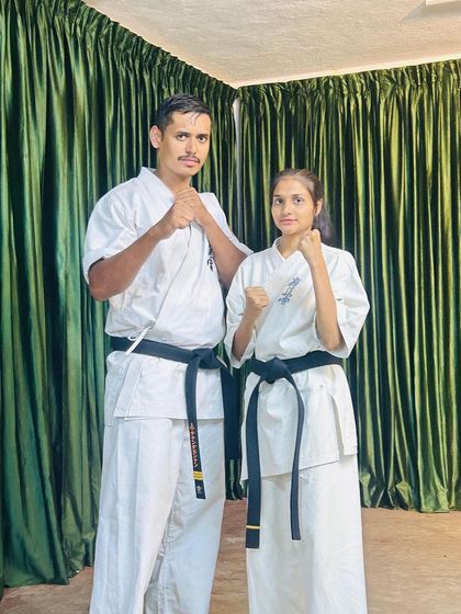 A picture with one of our talented female black belt students at the Ooty camp. Strength and skill know no gender.
