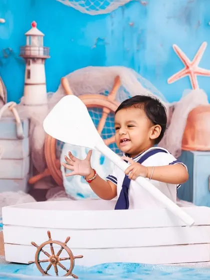 Ahoy, little sailor! My nautical themed photoshoots are perfect for adventurous little ones. With a boat prop, sailor outfit, and a sea-inspired backdrop, I create a playful scene for your baby's portrait session.