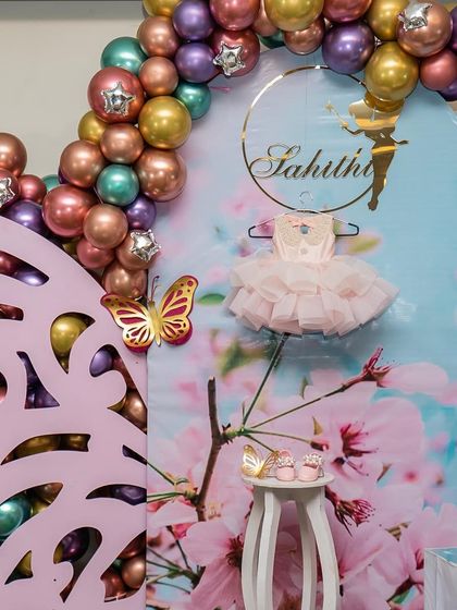 The joy on the faces of these two cutie pies made all the last-minute changes due to rain completely worth it. This fairy-themed party featured a beautiful custom backdrop with their first dress and shoes on display.