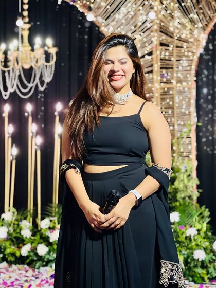 A happy moment on stage, surrounded by beautiful lighting. I love the grand scale of Sangeet nights.