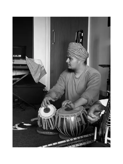 A candid black and white shot during a practice session. The focus is intense as I work on the finer details of a composition.