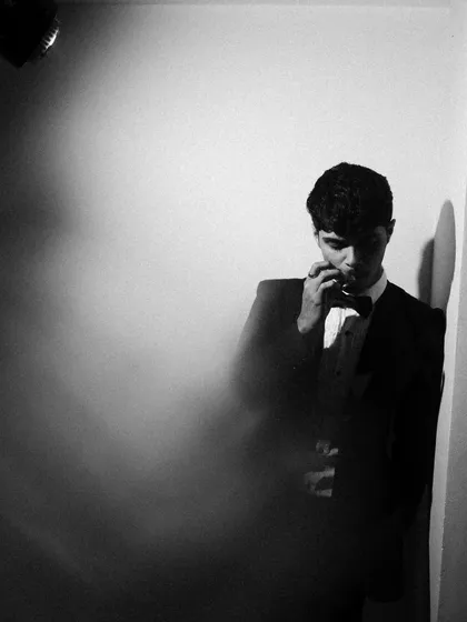 More from the black and white tuxedo series, exploring different poses and lighting angles. I used smoke and shadows to add texture and mood.