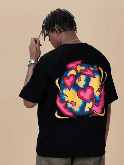 The 'World of Lovers' tee is a standout piece. The back features a vibrant, multi-color graphic with a high-density puff print that gives it a 3D texture you can feel.