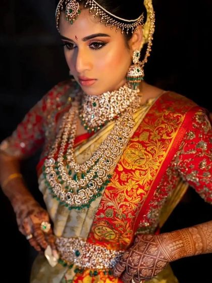 A duplicate of 229, showing the bride's regal pose and the beautiful stain of her mehndi.
