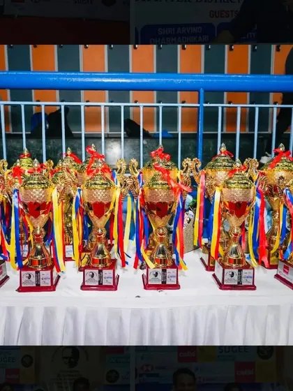 A table full of trophies waiting to be awarded at the Yonex-Sunrise Maharashtra State Championship, an event we proudly organized.