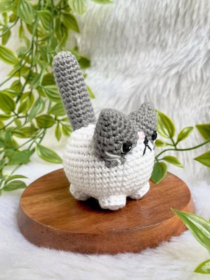 A grumpy but cute little cat plushie. I love his expressive face! This was a custom order to replicate a customer's pet, and I'm so happy with how he turned out.