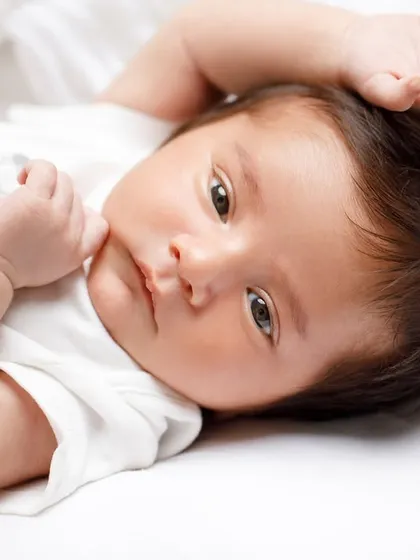 Those wide, curious eyes are just starting to take in the world. Even when they're awake, newborn sessions are calm and focused on your baby's natural expressions.