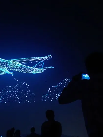 An audience member captures our record-breaking aerial plane formation. Our shows are designed to create viral moments and widespread awe.
