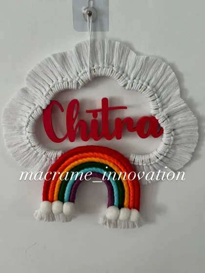 A clean, simple shot of the 'Chitra' name hanging, perfect for seeing the craftsmanship and design clearly.