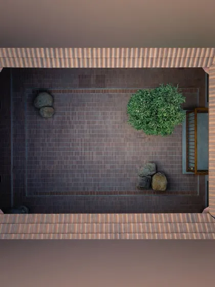 Design is in the details. This aerial view of a central courtyard reveals a minimalist, zen-like composition of brick, stone, and carefully placed trees, creating a piece of living art that brings light and nature into the core of the home.