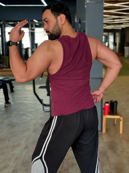 Determination in my workouts leads to progress that fuels my motivation. Here's a look at my back and arm definition.
