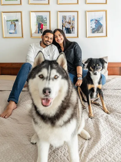 A cozy morning in bed with the whole pack. This is what a relaxed, at-home family session looks like. Luis the Husky and Sasha the Indie dog are completely part of the family, making for a perfect, authentic portrait.