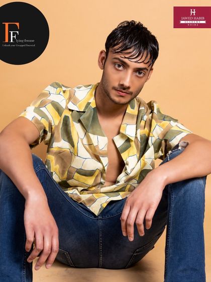 A seated pose from the male model shoot, highlighting the natural-looking skin finish achieved through our techniques.