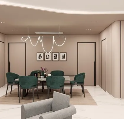 An open-plan living and dining concept for SVASA 2A, where a cohesive beige color scheme unifies the space. A bold green sofa and matching dining chairs add a touch of vibrant energy, while a flowing ceiling detail with cove lighting connects the two zones.
