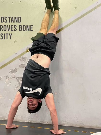 The handstand is more than just a cool party trick. It's a weight-bearing exercise that improves bone density, particularly in the wrists, arms, and shoulders.