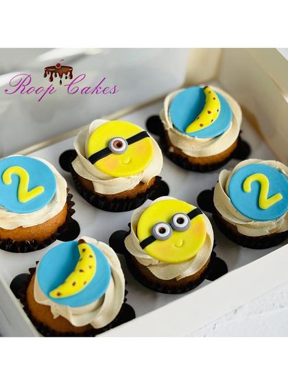 These fun Minion cupcakes were for a 2nd birthday celebration. I created handmade fondant toppers featuring the lovable Minions, their favorite bananas, and the birthday number.