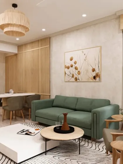 A bright and airy living room with a natural aesthetic. The sage green sofa and light wood paneling create a calm and inviting atmosphere, perfect for a modern family home.