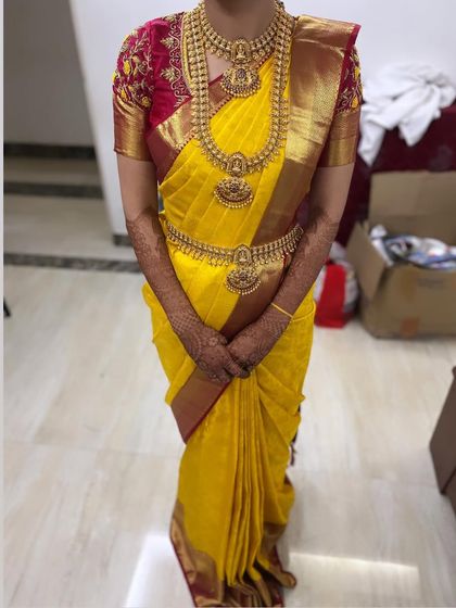 A perfectly pleated yellow silk saree, draped by me. Flawless draping is key to completing a traditional bridal look.