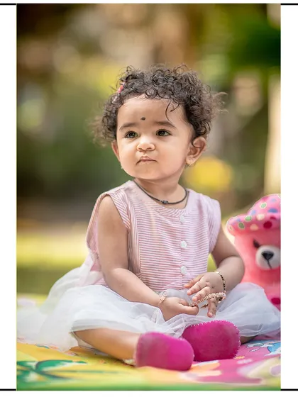 A more serious, thoughtful portrait from the same outdoor session, showing a different side of her personality.