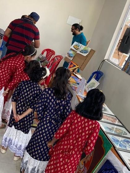 Children curiously looking at the artworks during an exhibition at our apartment's clubhouse.