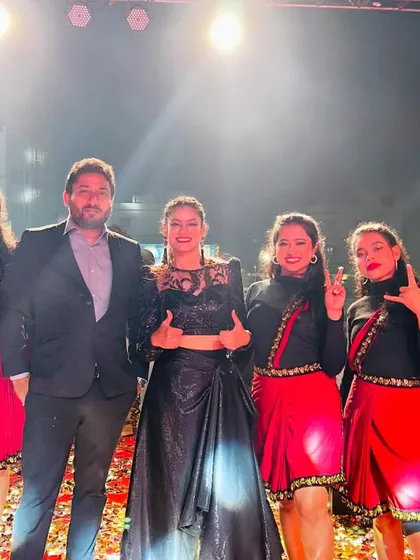 Posing with my talented team and the event organizer after a successful New Year's show. We pride ourselves on delivering professional and memorable entertainment for every client.