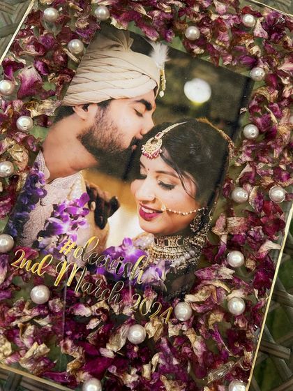 A close-up detail of the corner of the floral photo frame. You can see the individual orchid petals and pearls, all perfectly preserved in crystal clear resin.