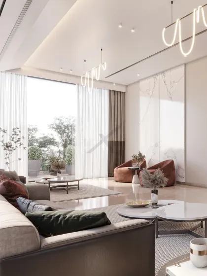 We designed this living room with a focus on light and openness. The large window connects the interior to a green terrace, while the custom pendant lights add a sculptural element to the high ceiling.