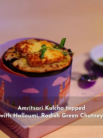 A dish from the 'Sounds of India' menu: Amritsari Kulcha topped with Halloumi and Radish Green Chutney, representing the flavors of Punjab.