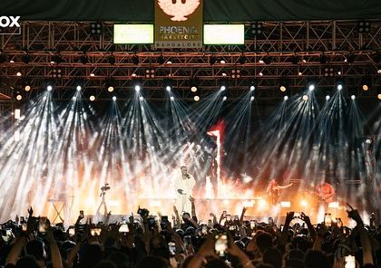 The full stage view for King's concert, showcasing the impressive lighting rig and the massive, engaged audience.
