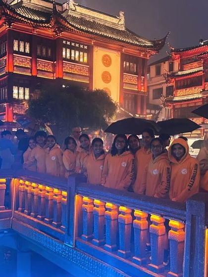 The team taking in the sights of the beautifully lit buildings in Shanghai. A magical end to a victorious trip.