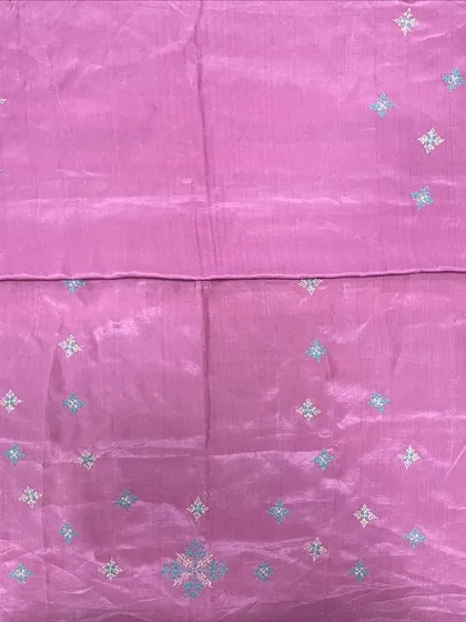 A lovely pink silk saree with delicate, scattered Kasuti butis. This is a great example of how embroidery can add a subtle, elegant touch without overwhelming the fabric.