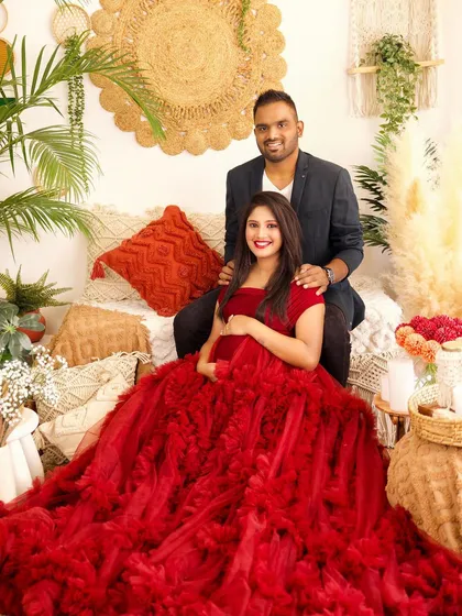 My boho-themed studio setup is perfect for warm, textured maternity portraits. The combination of a beautiful ruffled gown and natural elements like pampas grass creates a stunning, romantic feel.