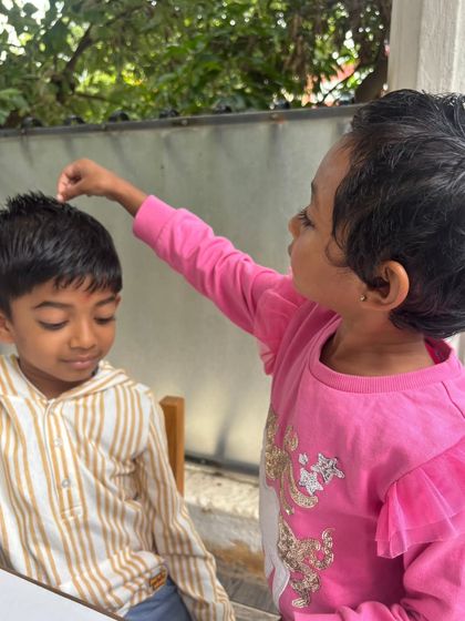 More moments from our Raksha Bandhan celebration, showing children tying rakhis and sharing sweets, learning about mutual care and respect.
