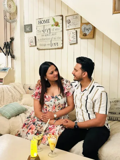 Some of the best stories unfold in the quiet corners of the cafe, like this cozy nook under the stairs. It’s a favorite spot for couples to share heartfelt conversations and enjoy a private moment together, away from the world.