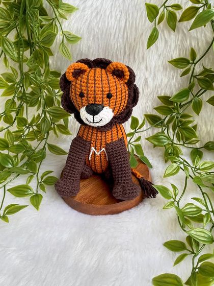 A unique lion created from a child's drawing! I love bringing your creative ideas to life. This striped lion with the initial 'M' is a truly one-of-a-kind creation.