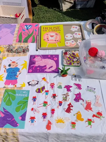 Here's a look at how my digital doodles become physical art you can own. This setup shows a collection of my whimsical wall art prints, a variety of indie illustrated stickers, and my self-published zine, "House of Cards." It’s so fun seeing them all together.