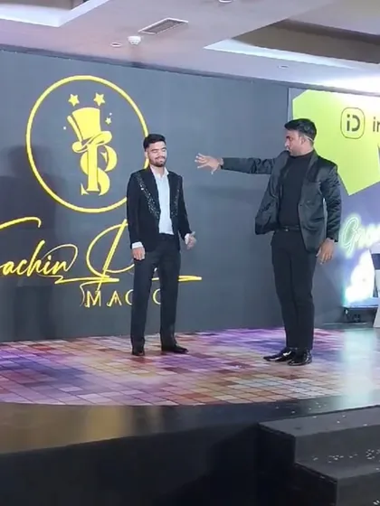 Guiding a volunteer through a mind-bending illusion on stage. My goal is to make them the star of the moment.