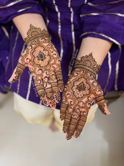 An example of my elegant and minimal work, perfect for an engagement. This design features a beautiful lotus at the center of the palm, surrounded by graceful patterns that are both modern and traditional.