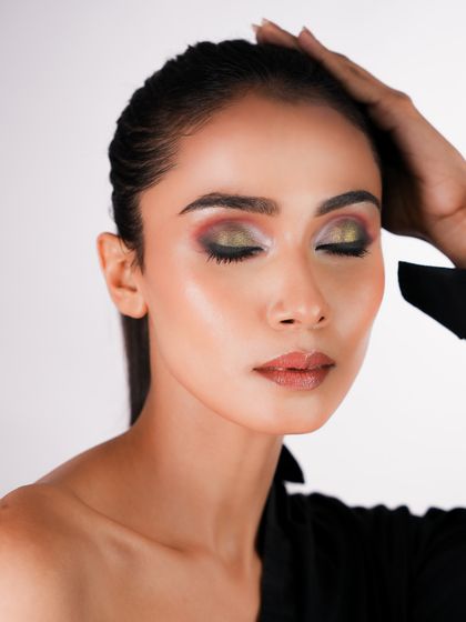 This image showcases a multi-tonal halo eye with shades of gold, red, and black. My creative makeup module encourages you to play with colors and textures.