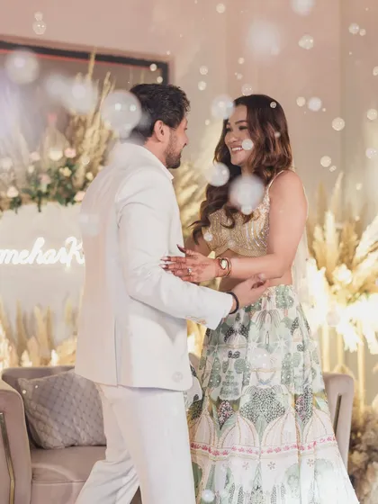 A bubble-filled, romantic moment between the couple at their engagement party.