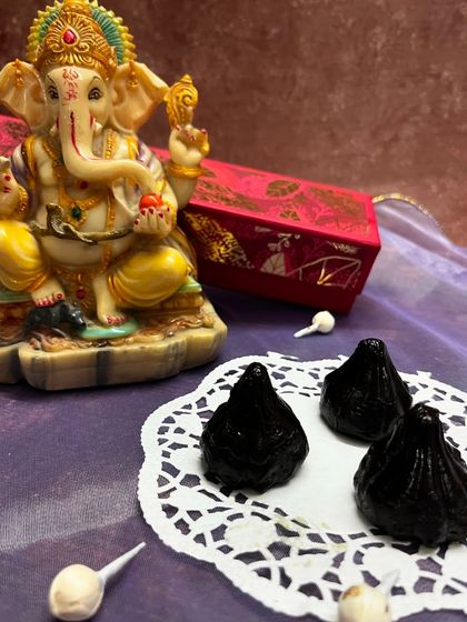 A closer look at my dark chocolate modaks, filled with a rich truffle center. They are perfect for dark chocolate lovers.