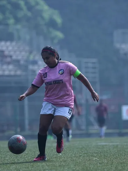 Our team captain on the ball, leading by example with composure and skill.